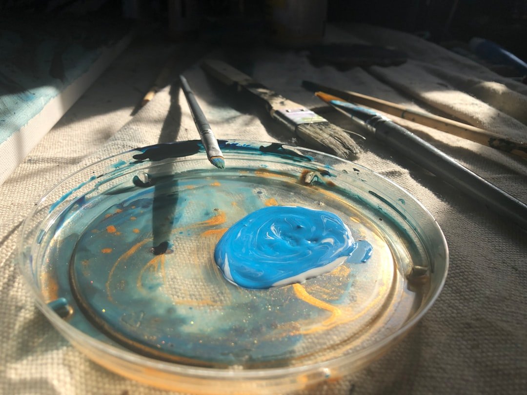 a glass bowl with a blue substance inside of it