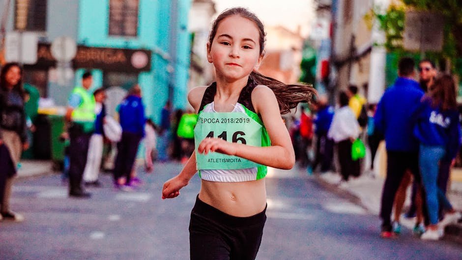A determined young girl running in a city marathon, showcasing effort and energy.