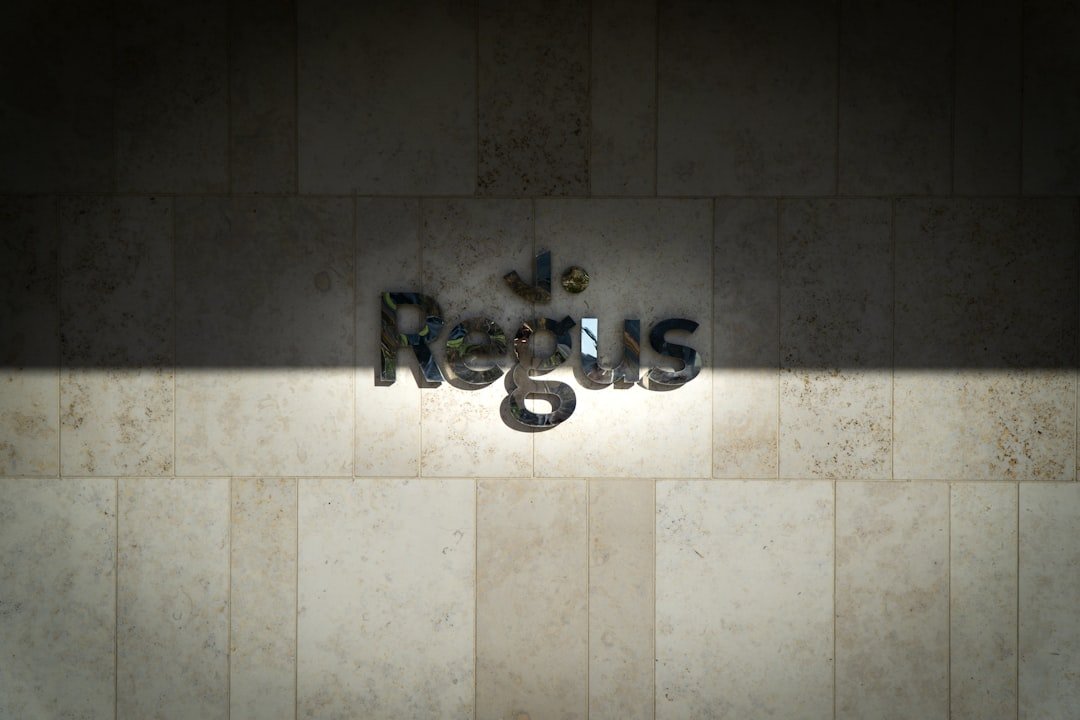 stainless steel faucet on white ceramic wall tiles