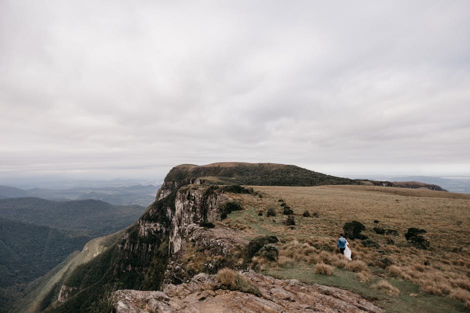Dramatic vista of a mountain cliff with an overcast sky in Cambará do Sul, perfect for travel imagery.