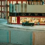 a model of a street scene with cars and people