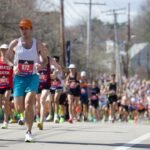 A large group of people running down a street