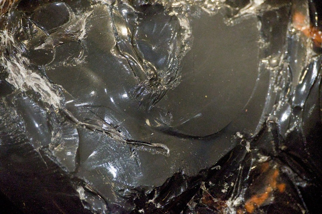 Close-up of dark, glossy, textured material